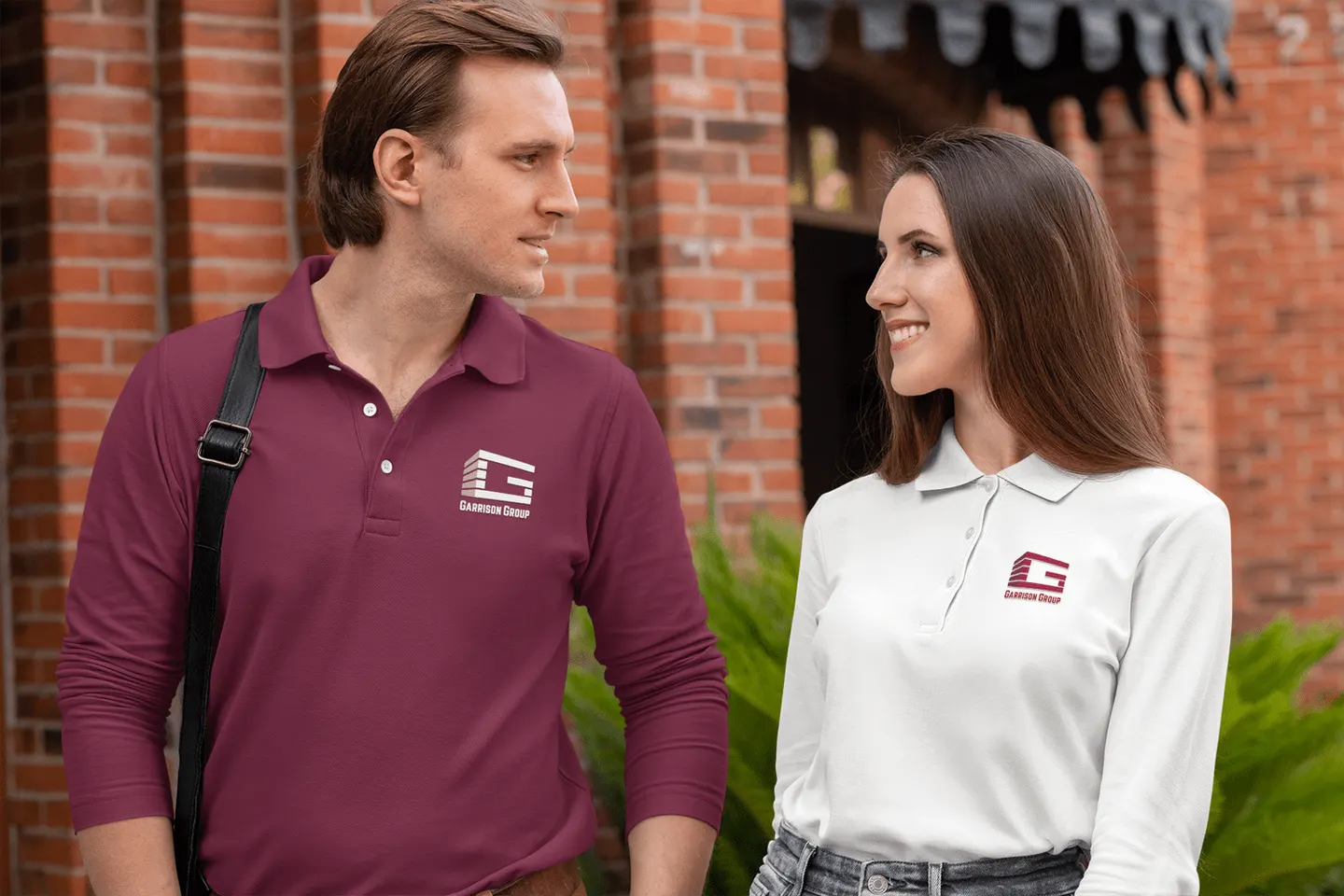 Garrison Group embroidered logo on burgundy and white team apparel